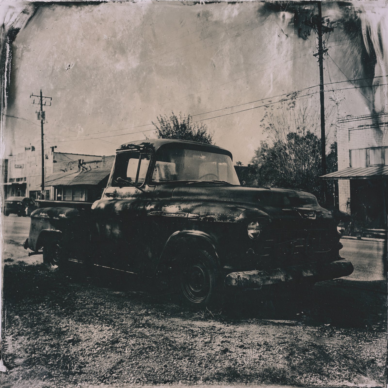 An old pickup truck on a small town street